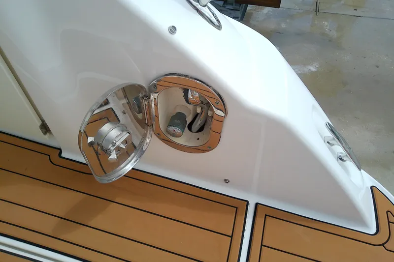 Slide: The Image of Sea Ray Sundancer 280, 2012 model, showing open fuel cap on teak deck. - 13