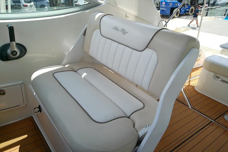 Slide: The Image of Luxury seating on 2012 Sea Ray Sundancer 280 boat, featuring elegant white upholstery. - 16