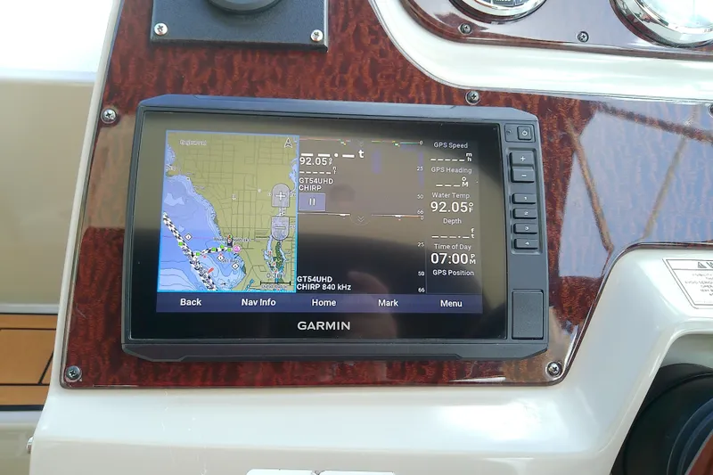 Slide: The Image of Garmin GPS display on 2012 Sea Ray Sundancer 280 boat dashboard, showing navigation map. - 24