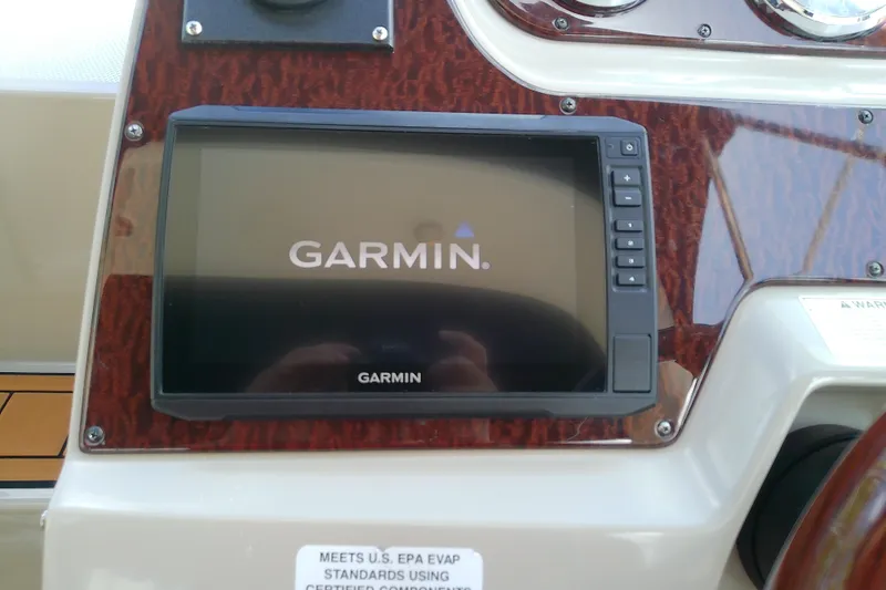 Slide: The Image of Garmin navigation system on 2012 Sea Ray Sundancer 280 dashboard. - 23