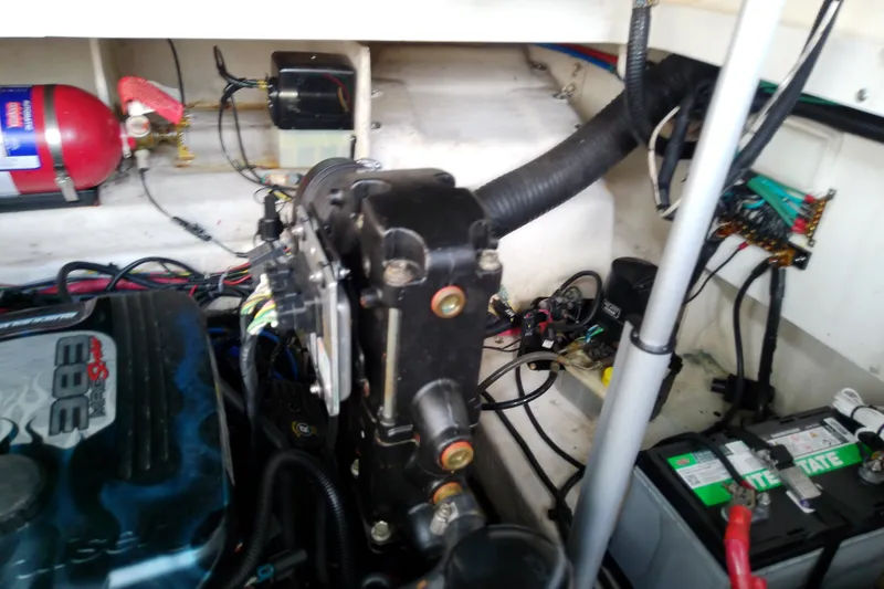 Slide: The Image of Engine compartment of 2012 Sea Ray Sundancer 280 with visible wiring and components. - 59