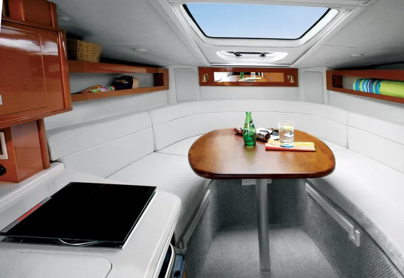 Slide: The Image of Manufacturer Provided Image: Interior of 2012 Sea Ray 280 Sundancer with dining table and seating. - 38