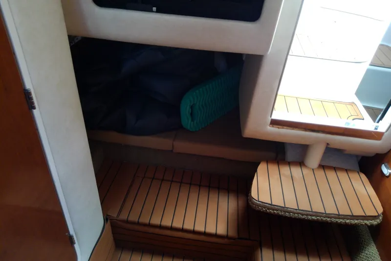 Slide: The Image of Interior cabin of 2012 Sea Ray Sundancer 280 with wooden flooring and seating area. - 44