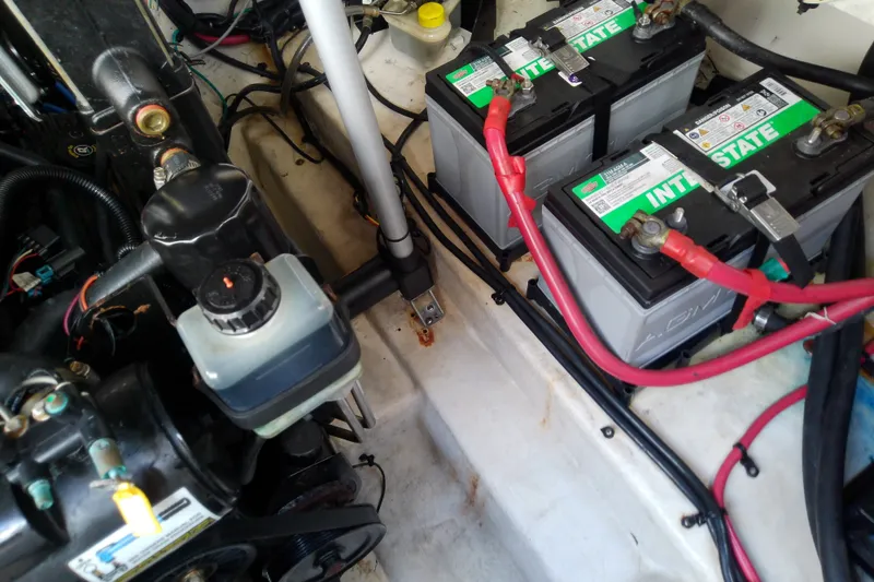 Slide: The Image of Engine compartment of 2012 Sea Ray Sundancer 280 with dual Interstate batteries. - 58