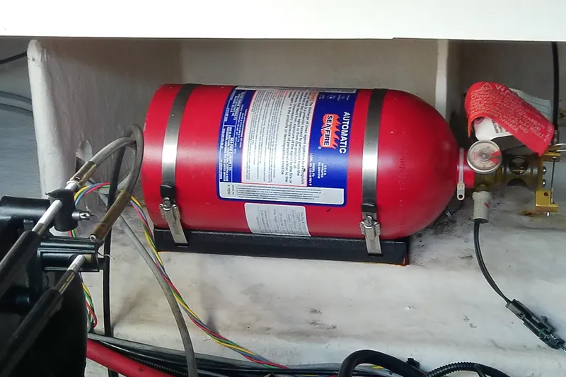 Slide: The Image of Fire suppression system in a 2012 Sea Ray Sundancer 280 boat engine compartment. - 61