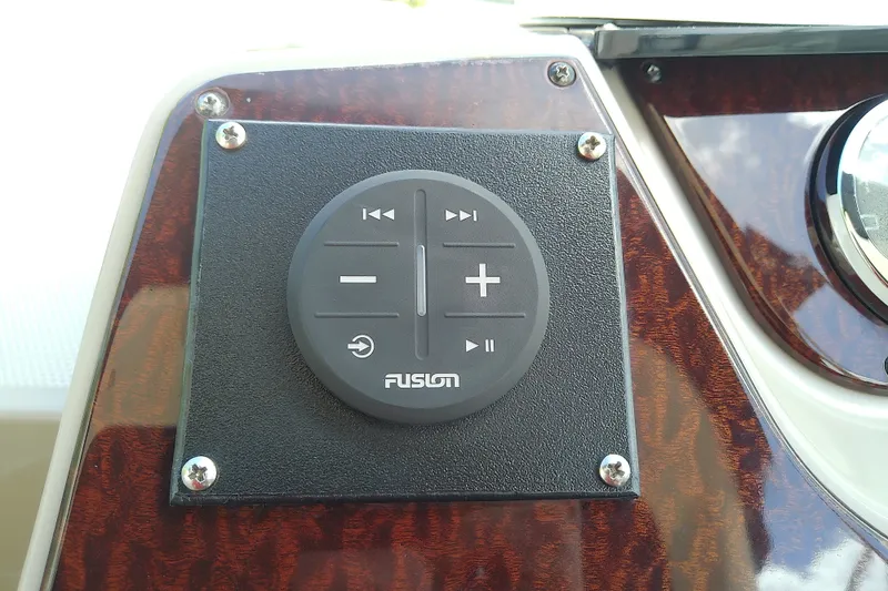 Slide: The Image of Fusion audio control panel on 2012 Sea Ray Sundancer 280 boat dashboard. - 26