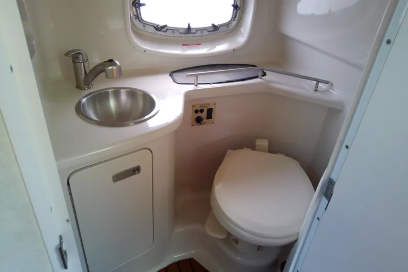 Slide: The Image of Compact bathroom in 2012 Sea Ray Sundancer 280 yacht with sink and toilet. - 47