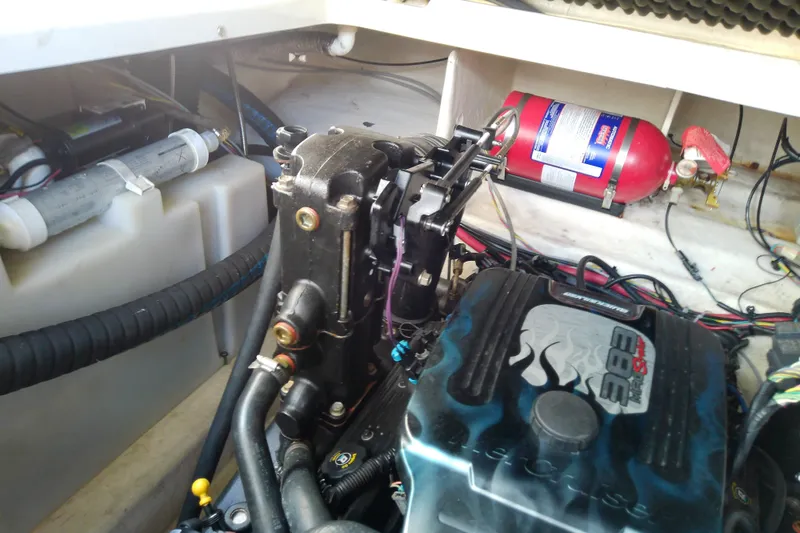 Slide: The Image of Engine compartment of a 2012 Sea Ray Sundancer 280 with visible fire extinguisher. - 60