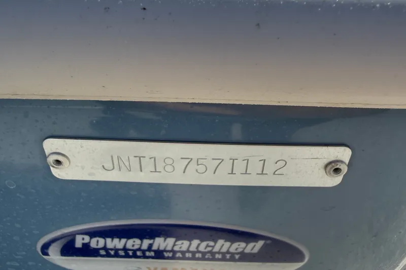 Slide: The Image of Hull identification number on a 2012 NauticStar 210 Coastal boat with PowerMatched warranty label. - 15