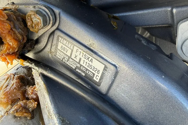 Slide: The Image of Close-up of Yamaha F115XA engine label on a 2012 NauticStar 210 Coastal boat. - 16