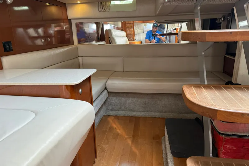 Slide: The Image of Interior of 2008 Sea Ray Sundancer 350 yacht with beige seating and wooden accents. - 28