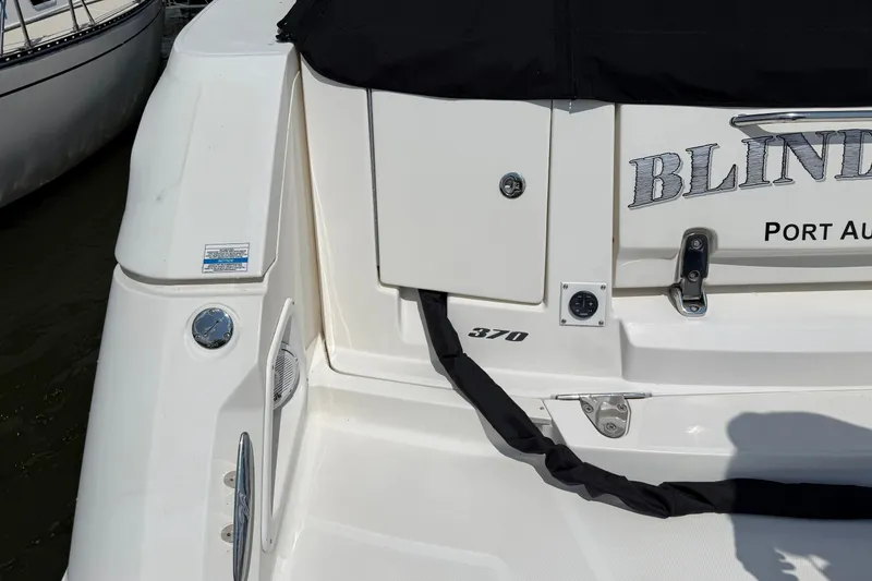 Slide: The Image of 2008 Sea Ray Sundancer 350 boat stern with "Blind" name and Port Austin location. - 9