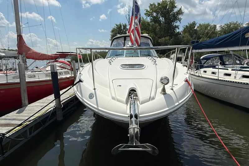 Slide: The Image of 2008 Sea Ray Sundancer 350 docked, front view with American flag, sunny day. - 3