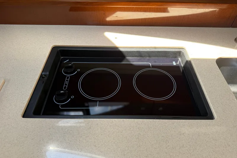 Slide: The Image of Built-in electric stove on 2008 Sea Ray Sundancer 350 yacht kitchen countertop. - 31