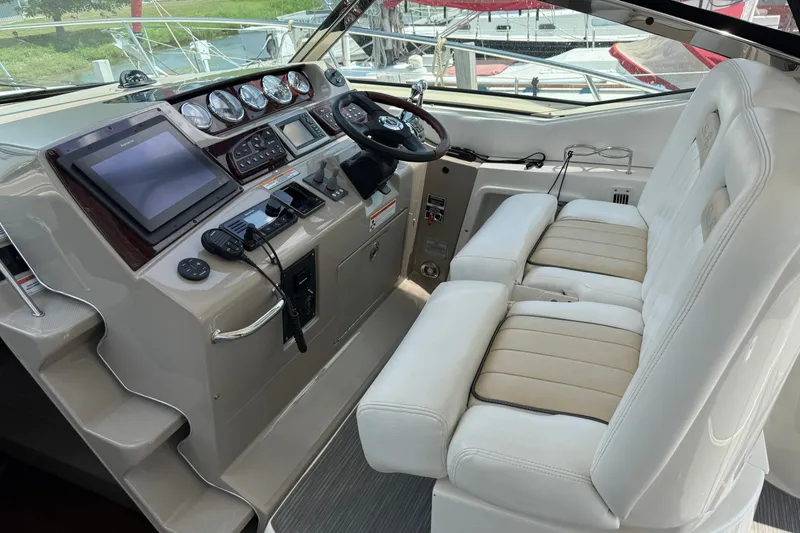 Slide: The Image of Cockpit of 2008 Sea Ray Sundancer 350 with dual seats and modern controls. - 15