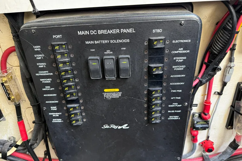 Slide: The Image of Main DC breaker panel on 2008 Sea Ray Sundancer 350 boat, showing switches and wiring. - 41