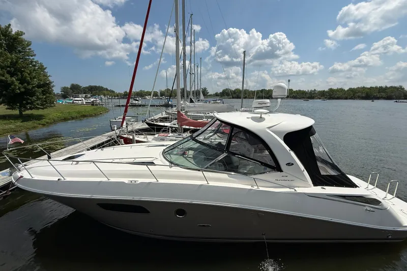 The Image of 2008 Sea Ray Sundancer 350 yacht docked on a sunny day with blue skies. - 0