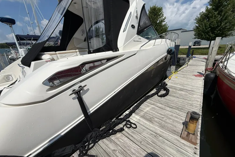 Slide: The Image of 2008 Sea Ray Sundancer 350 docked at marina under clear sky. - 8