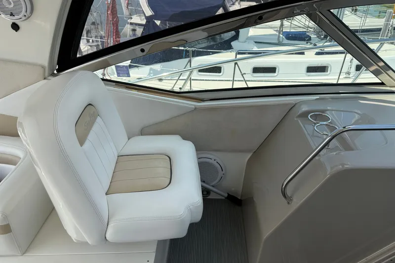 Slide: The Image of Interior of 2008 Sea Ray Sundancer 350 yacht with white seating and window view. - 16