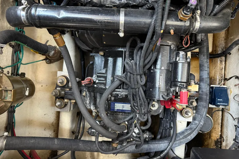 Slide: The Image of Engine compartment of a 2008 Sea Ray Sundancer 350, showcasing wiring and components. - 39