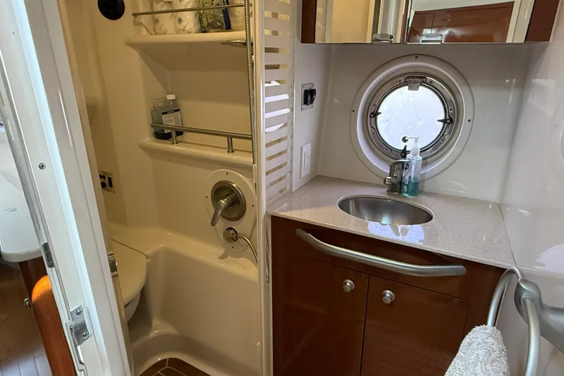 Slide: The Image of Bathroom interior of 2008 Sea Ray Sundancer 350 yacht with sink and porthole. - 23
