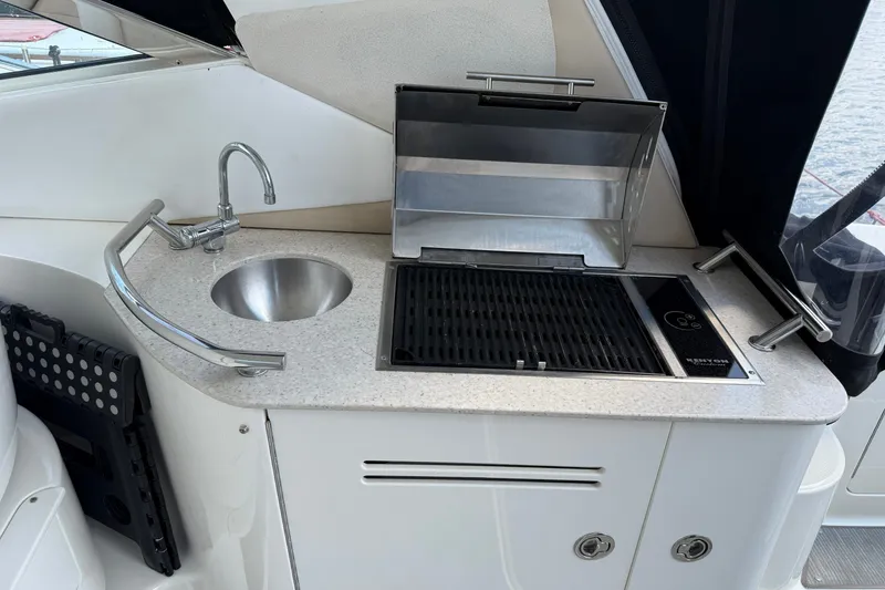 Slide: The Image of Outdoor kitchenette on a 2008 Sea Ray Sundancer 350 yacht with sink and grill. - 11
