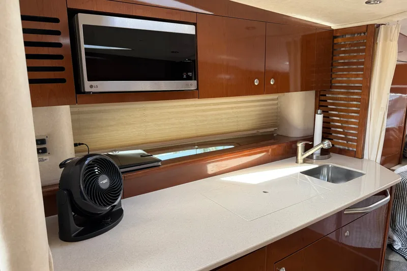 Slide: The Image of Luxurious kitchen area in 2008 Sea Ray Sundancer 350 yacht with modern amenities. - 22