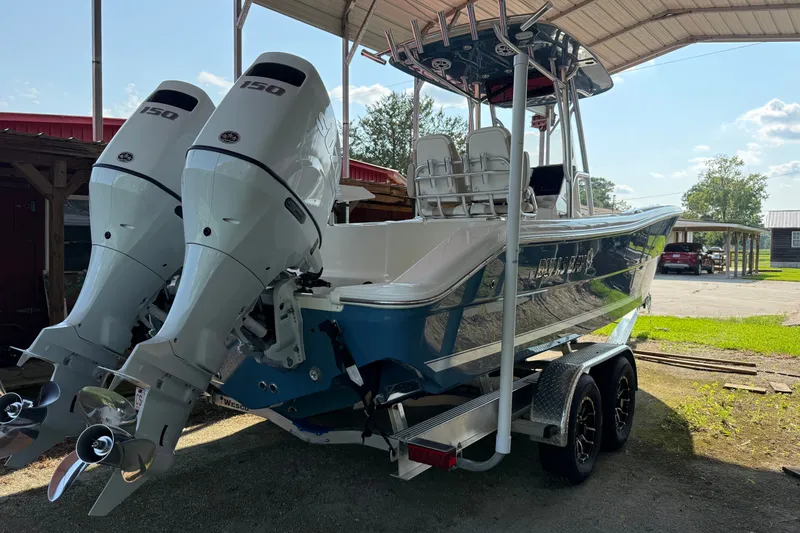 Slide: The Image of 2026 Bulls Bay 255 Center Console boat with dual engines on a trailer. - 6