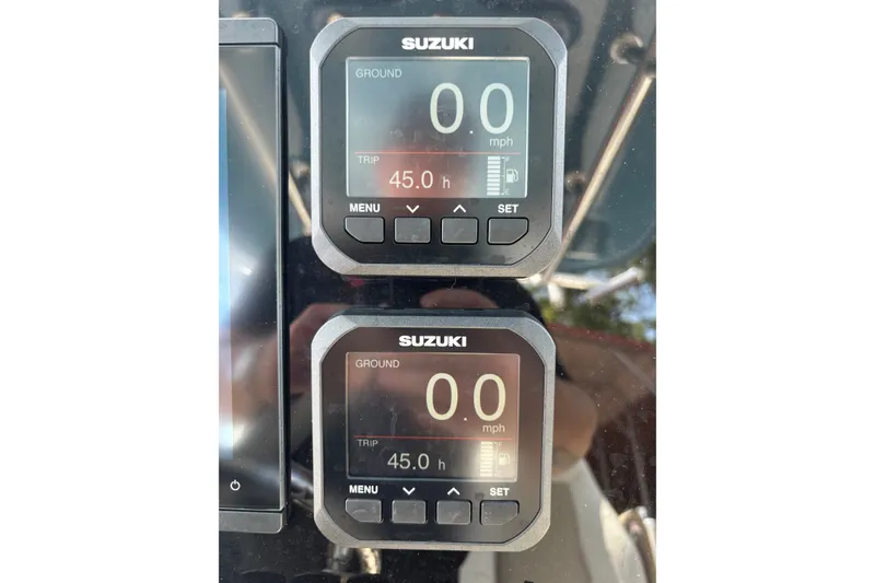 Slide: The Image of Suzuki digital displays on 2026 Bulls Bay 255 Center Console boat dashboard. - 20