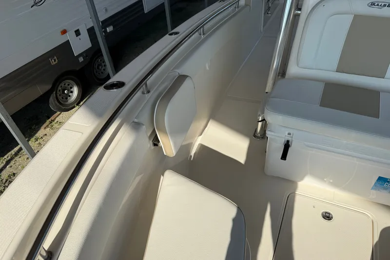 Slide: The Image of 2026 Bulls Bay 255 Center Console boat interior with seating and storage. - 24