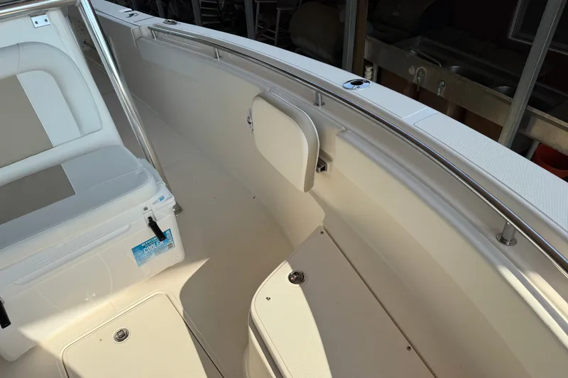 Slide: The Image of 2026 Bulls Bay 255 Center Console boat interior with seating and storage. - 25