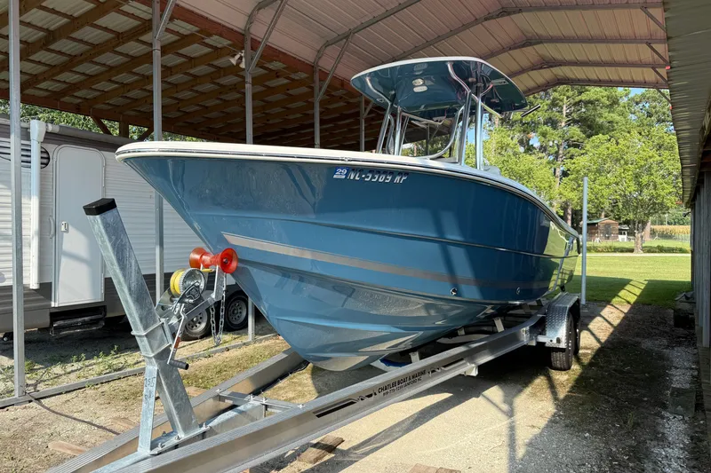 Slide: The Image of 2026 Bulls Bay 255 Center Console boat on trailer under shelter. - 1