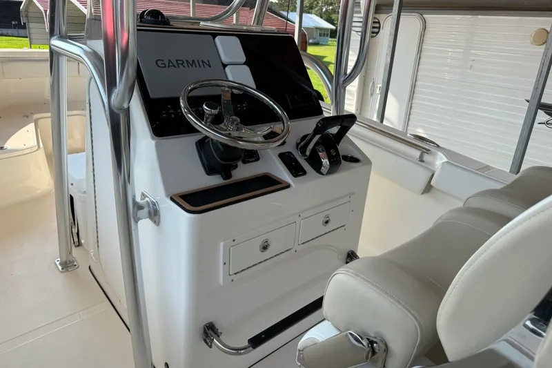 Slide: The Image of 2026 Bulls Bay 255 Center Console boat interior with Garmin navigation system. - 9