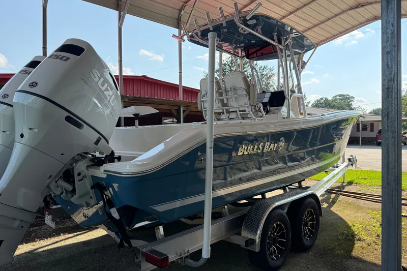 The Image of 2026 Bulls Bay 255 Center Console boat on trailer with Suzuki outboard engines. - 0