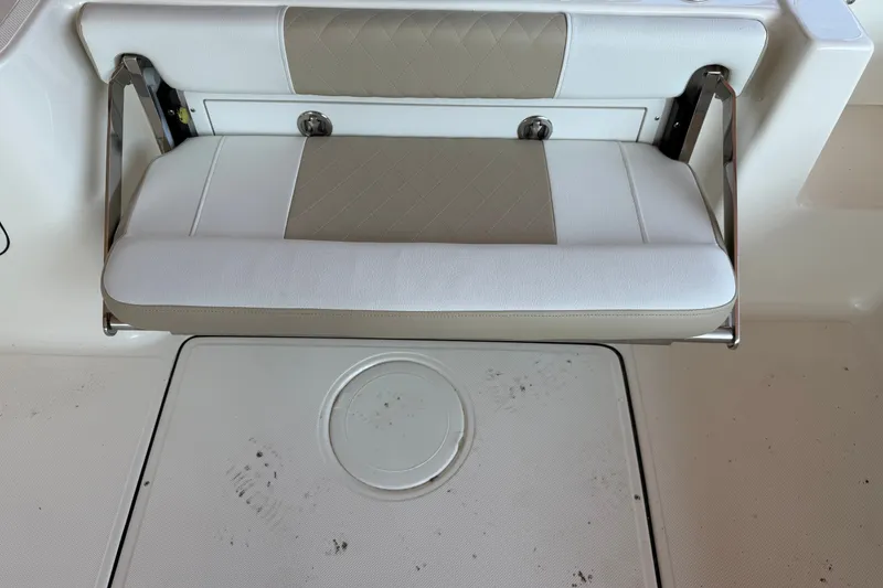 Slide: The Image of 2026 Bulls Bay 255 Center Console boat seat with white and beige upholstery. - 26