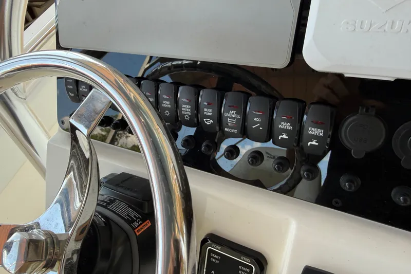 Slide: The Image of Steering wheel and control panel of 2026 Bulls Bay 255 Center Console boat. - 15