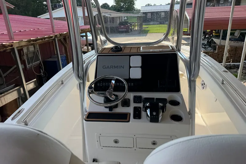 Slide: The Image of 2026 Bulls Bay 255 Center Console boat interior with Garmin navigation system. - 21