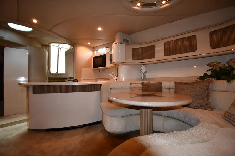 Slide: The Image of Luxurious interior of 1995 Sea Ray 630 Sundancer yacht with cozy seating and modern amenities. - 52
