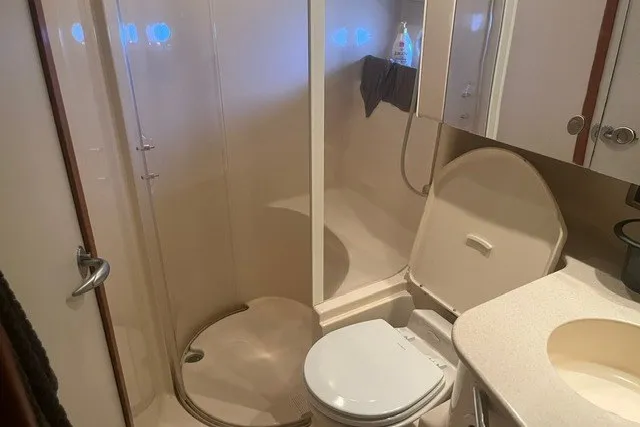 Slide: The Image of Bathroom interior of 2005 Sea Ray Sundancer 260 yacht with shower and toilet. - 16
