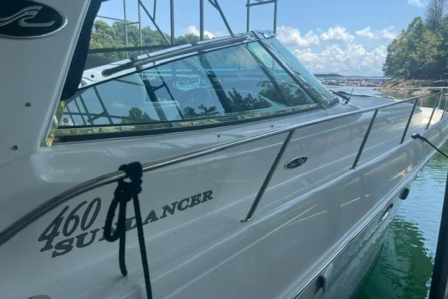 Slide: The Image of 2005 Sea Ray Sundancer 260 boat docked on a sunny day with clear skies. - 4