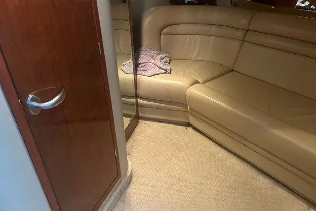 Slide: The Image of Luxurious interior of 2005 Sea Ray Sundancer 260 with beige leather seating. - 21