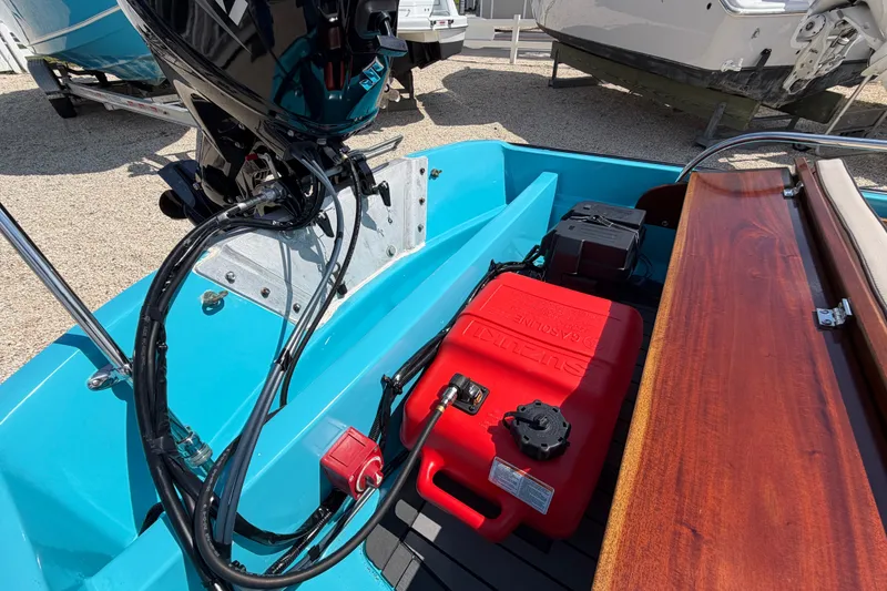 Slide: The Image of 1969 Boston Whaler 13 Super Sport boat interior with motor and fuel tank. - 18