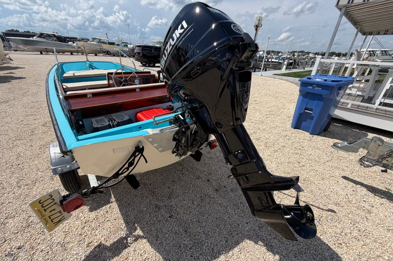 Slide: The Image of 1969 Boston Whaler 13 Super Sport with Suzuki outboard motor on a trailer. - 4