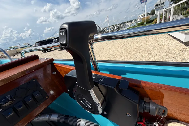 Slide: The Image of Throttle control on a 1969 Boston Whaler 13 Super Sport boat, dockside view. - 15