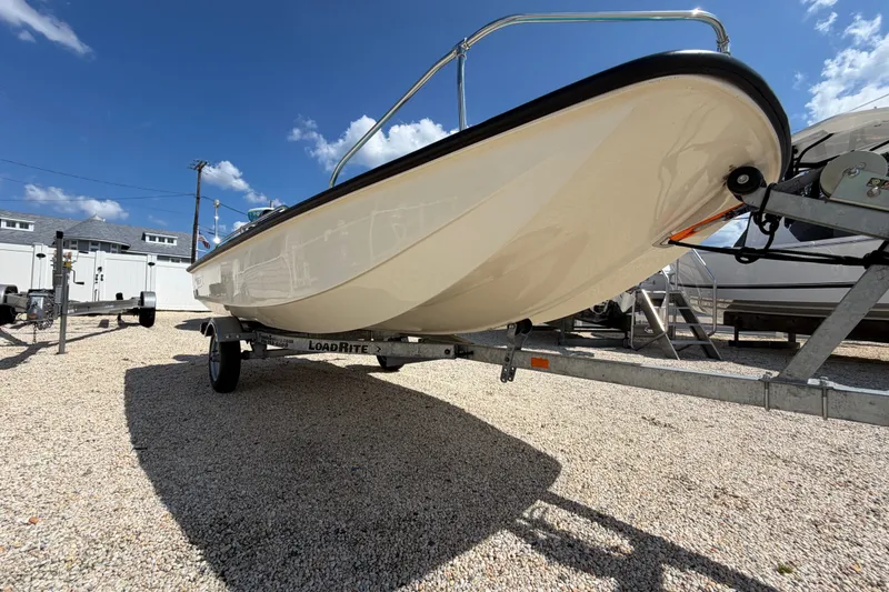 Slide: The Image of 1969 Boston Whaler 13 Super Sport boat on trailer under clear blue sky. - 21