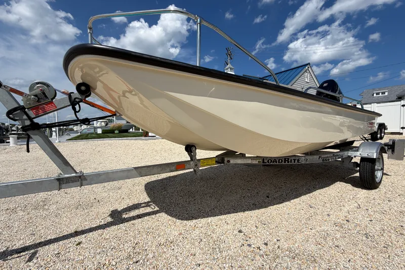 Slide: The Image of 1969 Boston Whaler 13 Super Sport on trailer under a clear blue sky. - 22