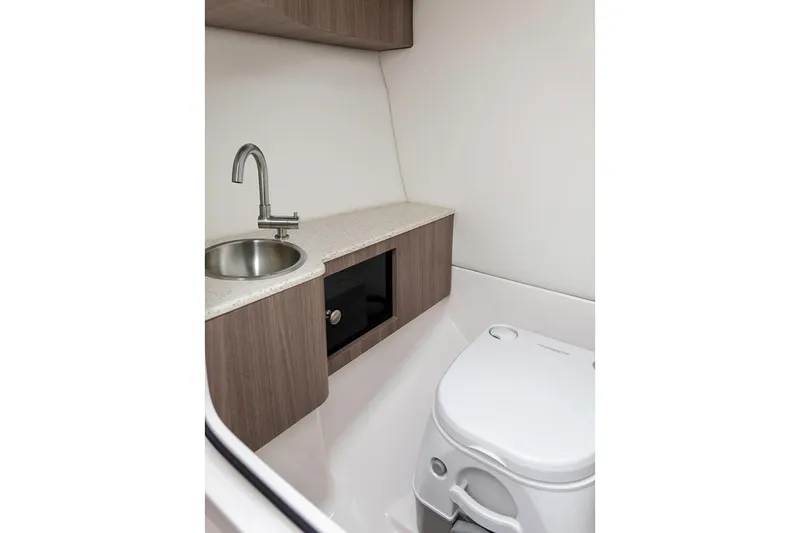 Slide: The Image of Manufacturer Provided Image: 2020 Regal LS6 Surf boat bathroom with sink and toilet. - 73
