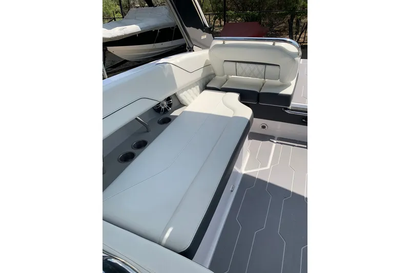 Slide: The Image of Luxurious seating on 2020 Regal LS6 Surf boat, featuring sleek white upholstery and modern design. - 28