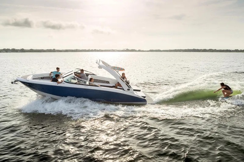 Slide: The Image of Manufacturer Provided Image: 2020 Regal LS6 Surf boat on water with people wake surfing. - 88