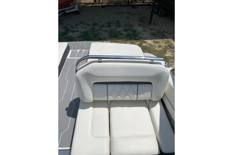 Slide: The Image of 2020 Regal LS6 Surf boat with white leather seating and sleek design. - 40